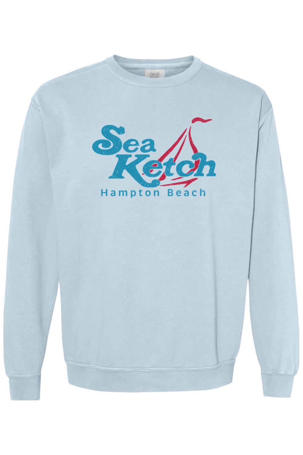 Light blue Comfort Colors crewneck sweatshirt featuring a Sea Ketch Hampton Beach graphic with a red sailboat design.