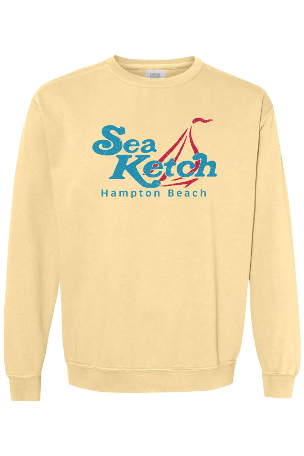 Light yellow Comfort Colors crewneck sweatshirt featuring a blue and red Sea Ketch Hampton Beach sailboat graphic.