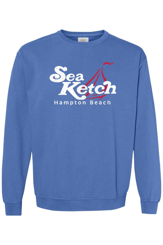 Blue Comfort Colors crewneck sweatshirt featuring a white Sea Ketch Hampton Beach graphic with a red sailboat icon.