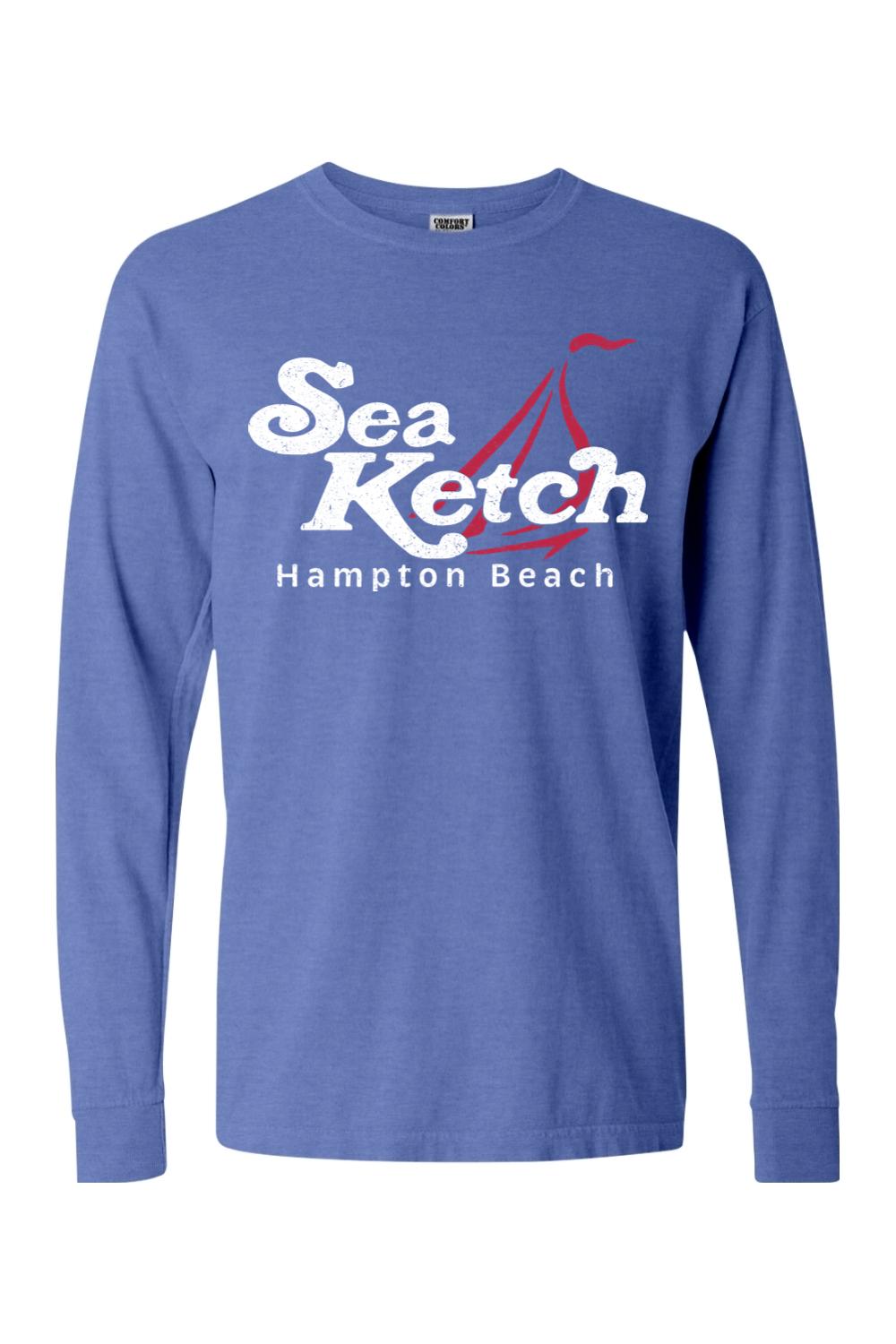 Blue Comfort Colors long sleeve cotton t-shirt featuring a white Sea Ketch Hampton Beach graphic and red sailboat.