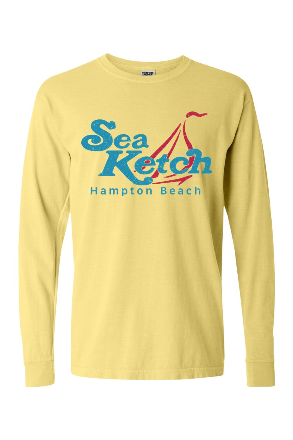 Pale yellow Comfort Colors long sleeve t-shirt with blue and red Sea Ketch Hampton Beach sailboat graphic.
