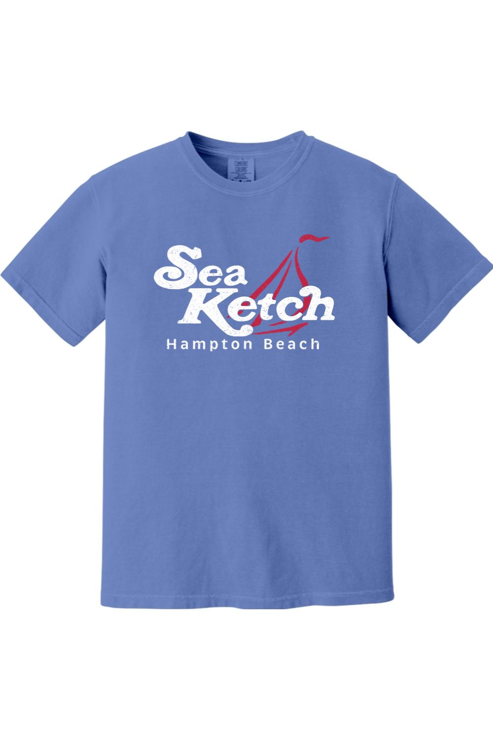 Blue Comfort Colors cotton t-shirt featuring a white and red Sea Ketch Hampton Beach sailboat graphic on the front.