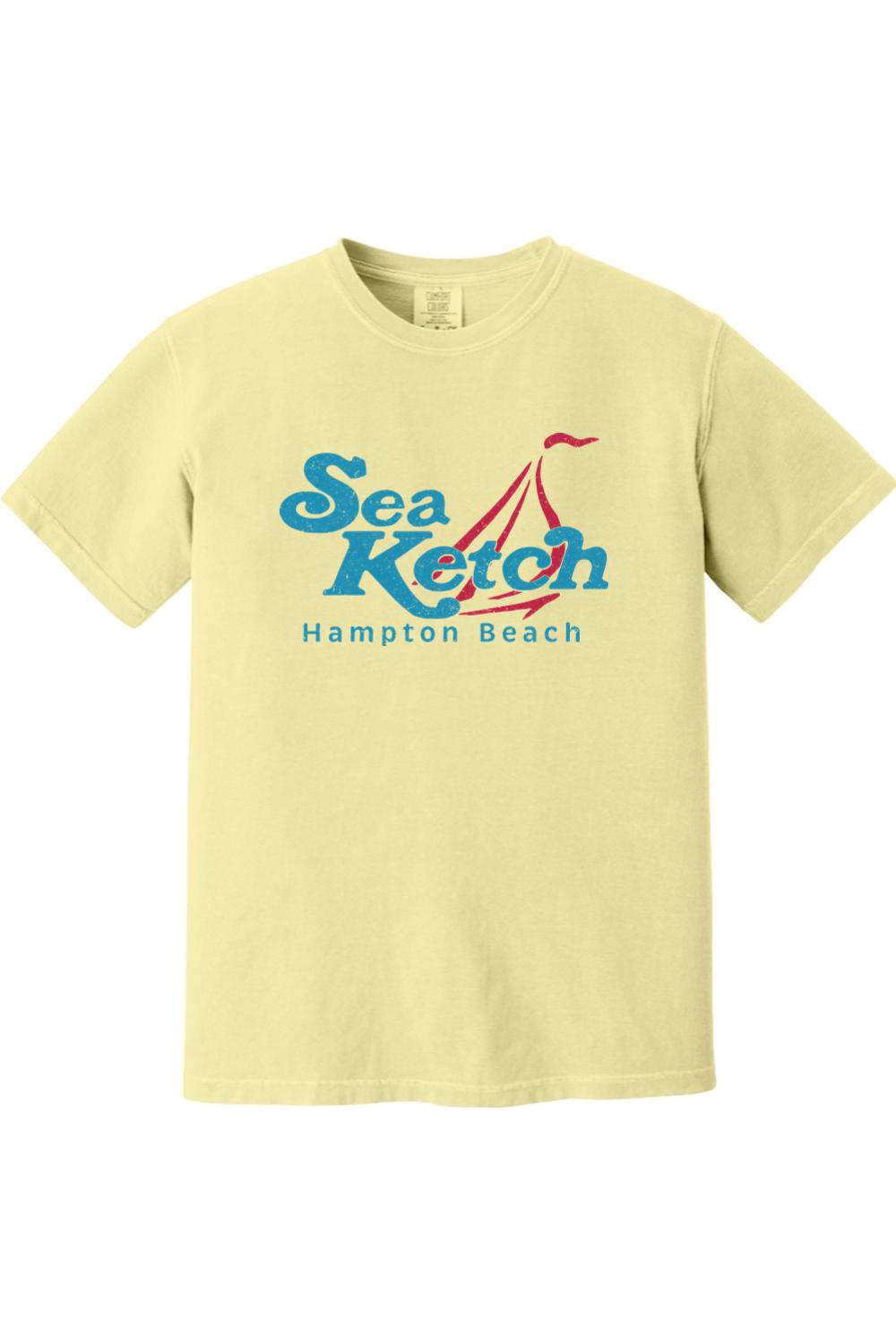 Pale yellow Comfort Colors cotton t-shirt featuring a blue and red Sea Ketch Hampton Beach sailboat graphic.