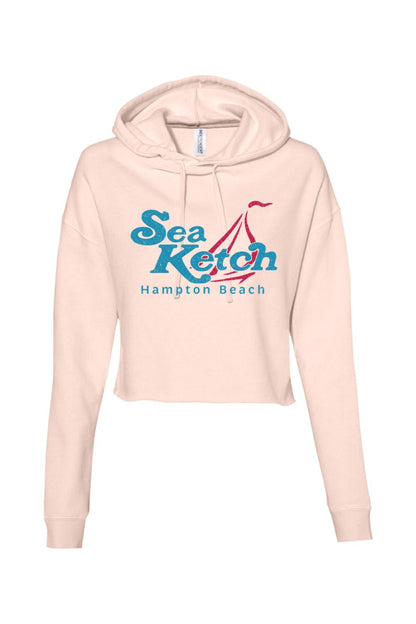 Light pink lightweight cropped hoodie with a blue and red Sea Ketch Hampton Beach sailboat graphic on the front.