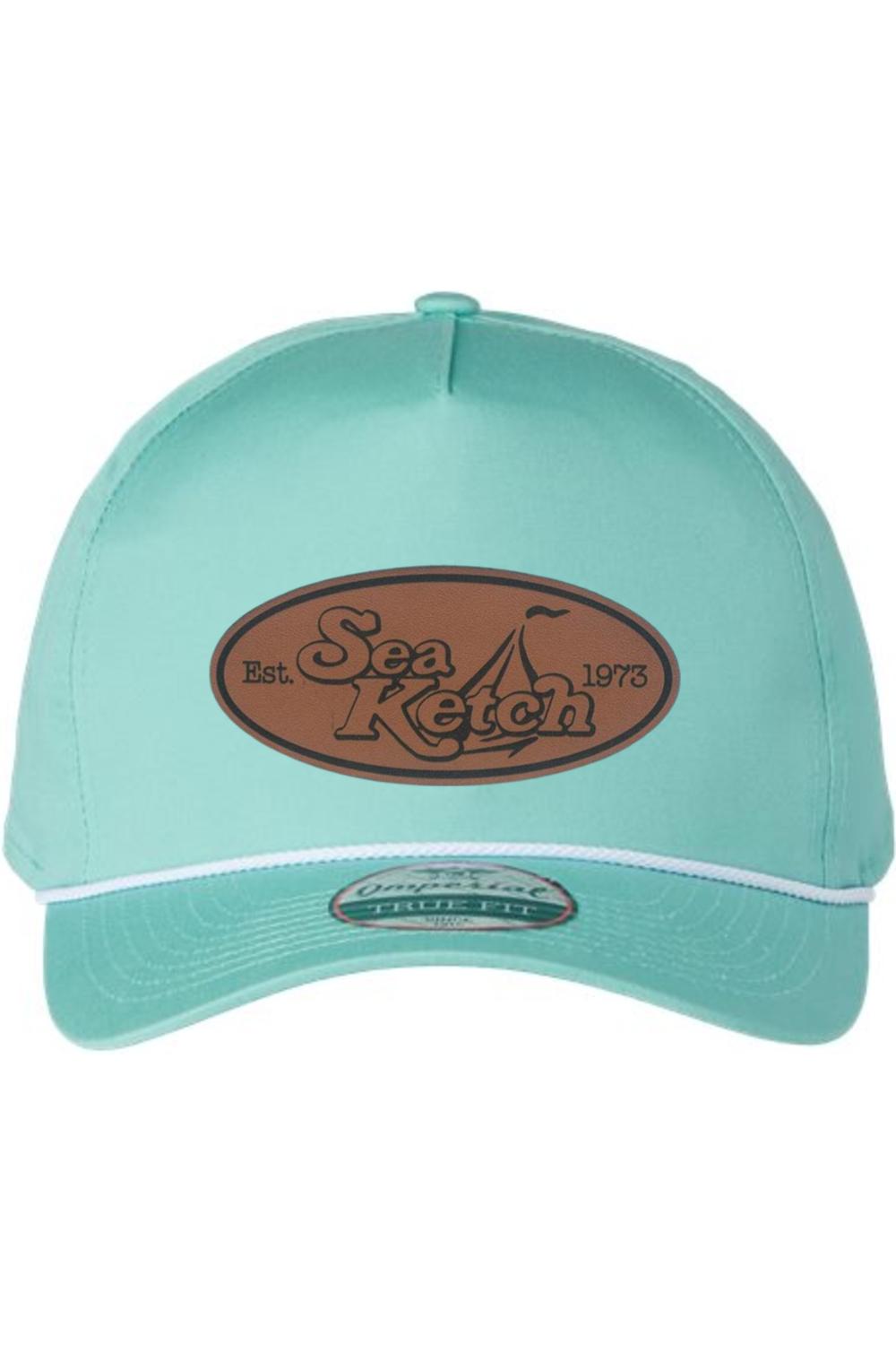 Light blue five-panel cotton twill hat with a brown leather Sea Ketch patch and white rope detail on the visor.