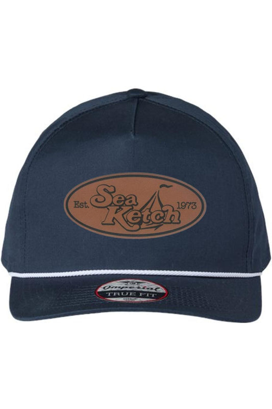 Navy blue cotton twill five-panel hat with a white rope trim and oval Sea Ketch leather patch on the front.