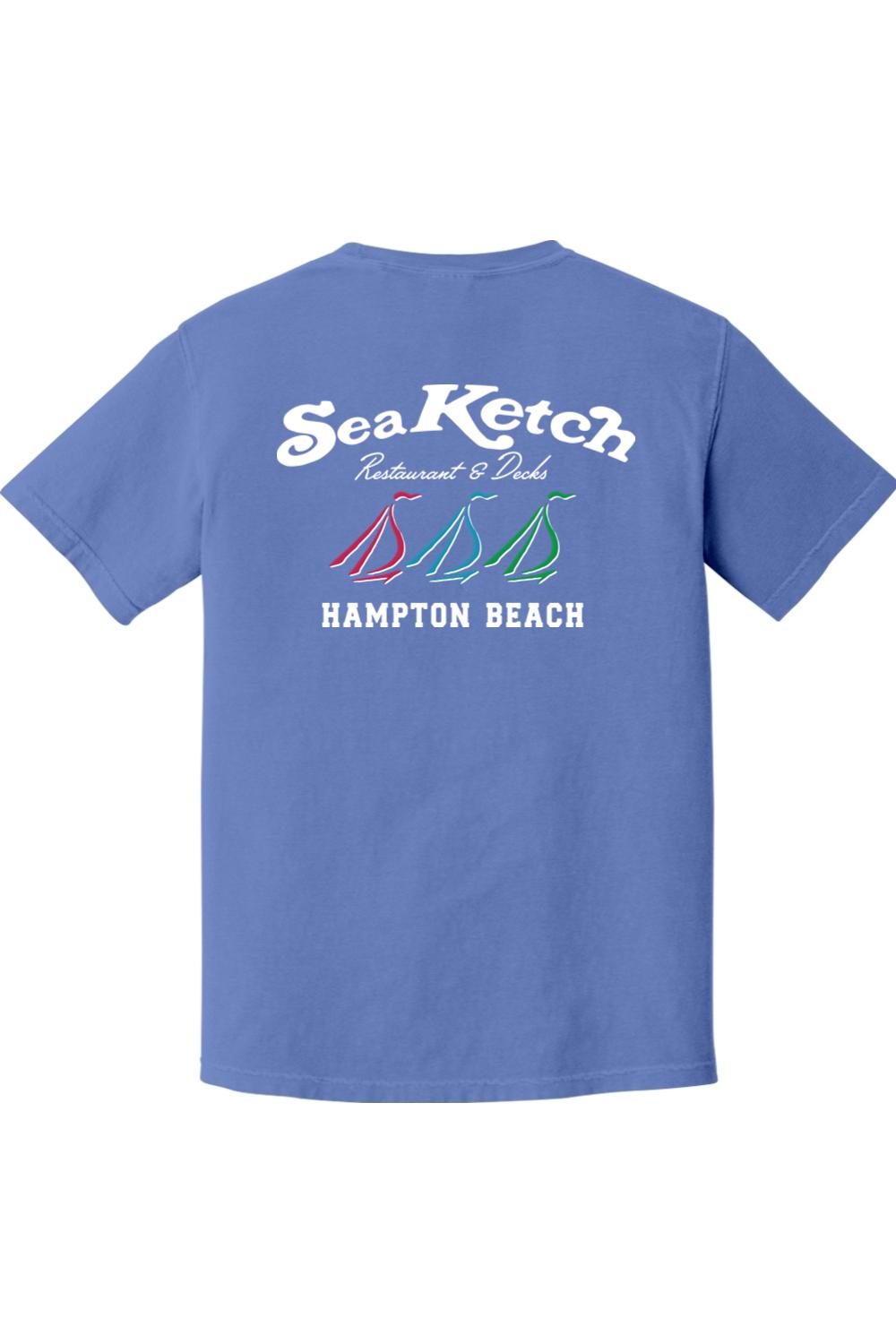 Blue Comfort Colors t-shirt featuring a Sea Ketch Hampton Beach graphic with three colorful sailboats on the back.