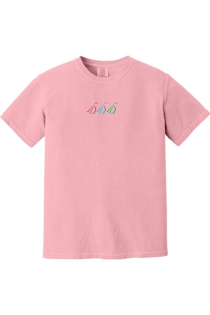 Light pink Comfort Colors unisex t-shirt featuring a small, colorful embroidered tri-sail nautical graphic on the chest.