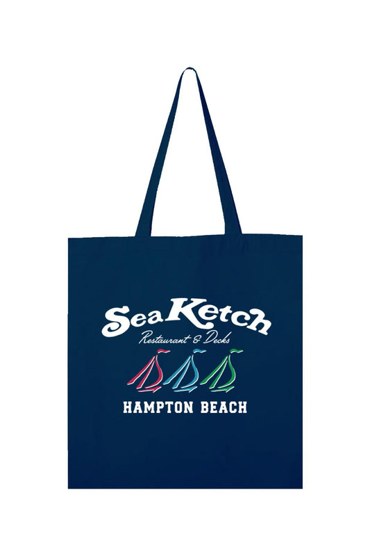 Navy blue canvas tote bag featuring a white Sea Ketch Hampton Beach logo with three colorful sailboat icons.