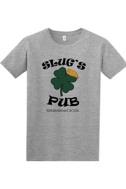 Grey cotton t-shirt featuring a Slug's Pub logo with a green shamrock wearing a yellow cap, established 2024.