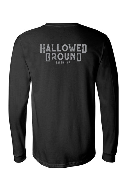 Black long sleeve cotton t-shirt featuring a distressed white Hallowed Ground Salem, MA graphic on the back.