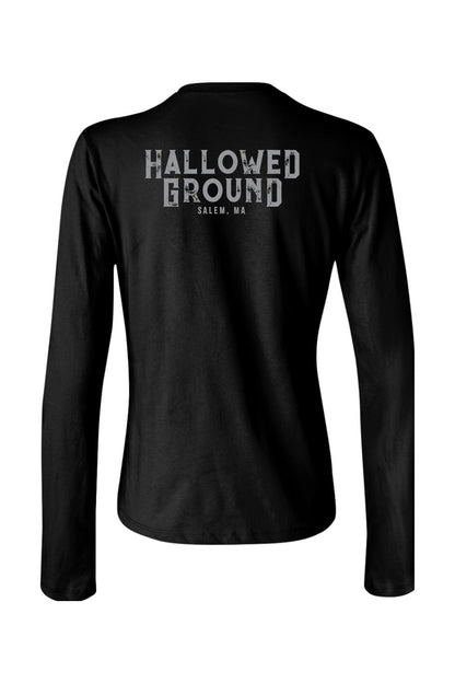 Black women's long sleeve cotton t-shirt featuring Hallowed Ground Salem, MA text on the back.