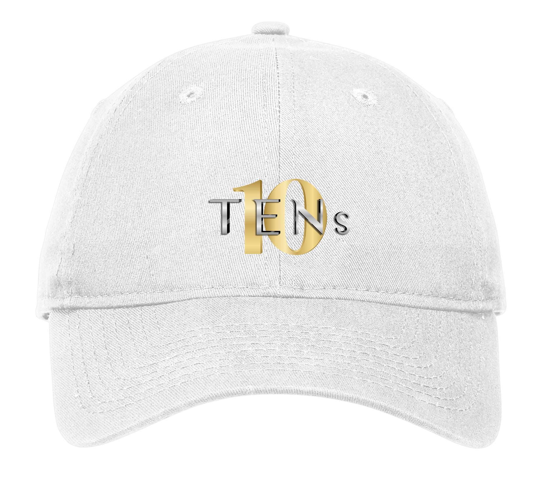 White unstructured cotton cap featuring a gold and silver TENS logo on the front with an adjustable D-clip strap.