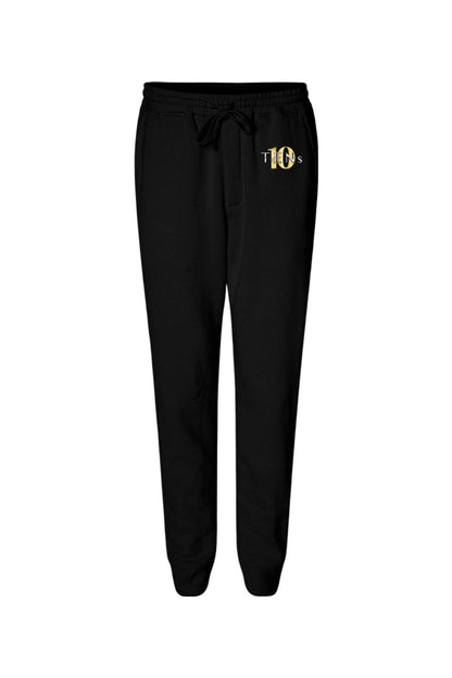 Black midweight cotton joggers with a drawstring waist and gold Tens Show Club logo on the left hip.