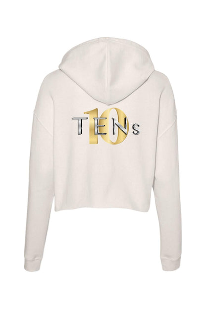 Off-white cropped hooded sweatshirt featuring a metallic gold and silver TENS logo on the back.