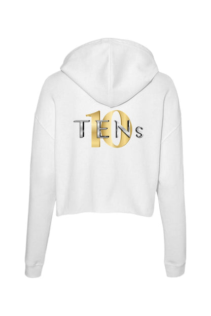 White cropped hooded sweatshirt featuring a gold and silver TENS logo on the back.
