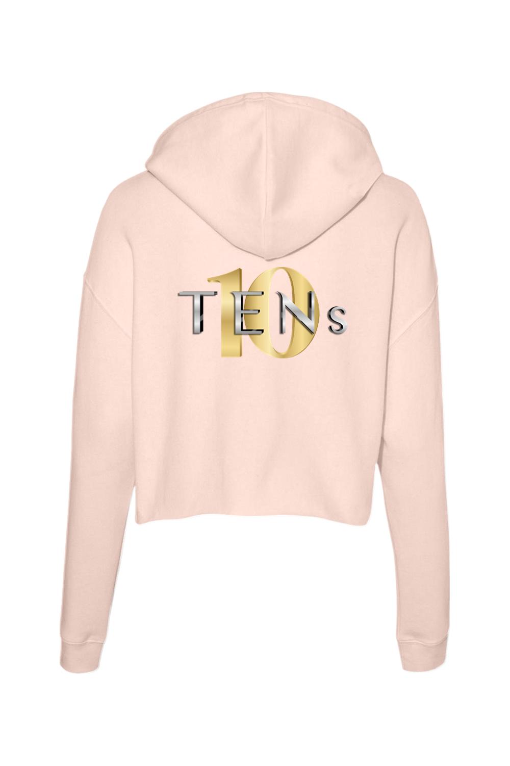 Light pink cropped cotton hoodie featuring a gold and silver TENS logo on the back.