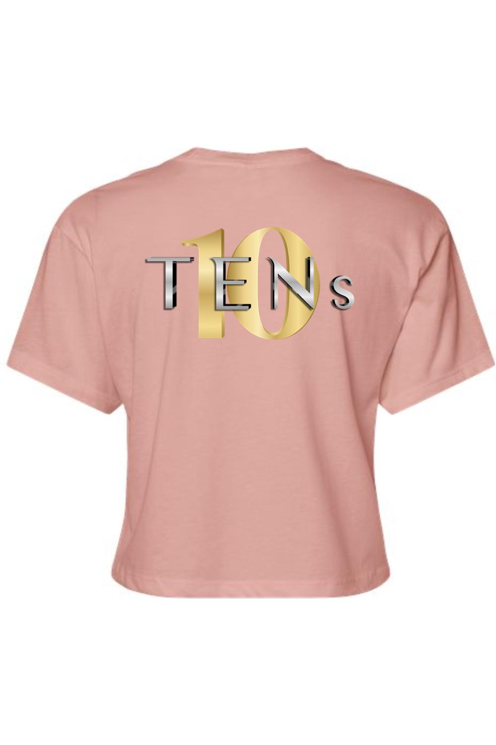 Dusty pink cotton women's cropped tee featuring a metallic gold and silver TENS logo graphic on the back.