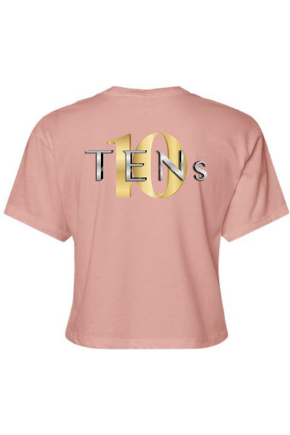 Dusty pink cotton women's cropped tee featuring a metallic gold and silver TENS logo graphic on the back.