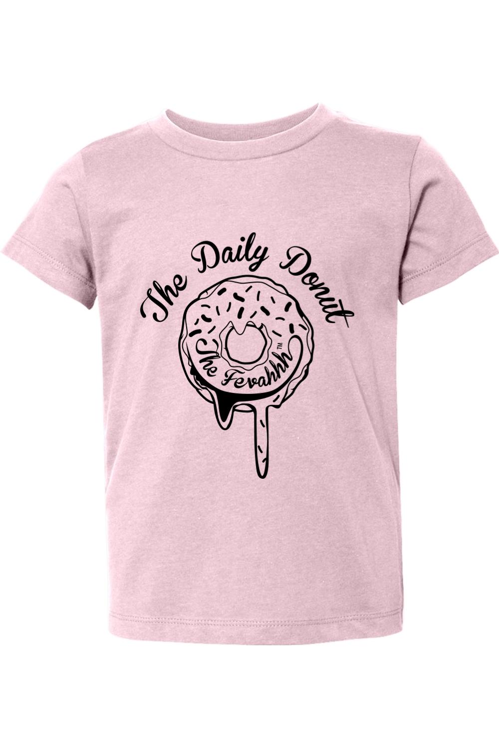 Soft pink toddler t-shirt featuring a black graphic of a dripping donut with The Daily Donut text.
