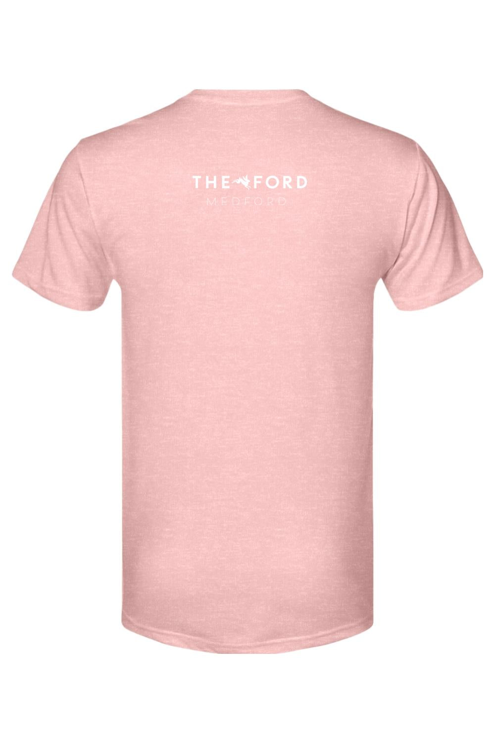 Soft pink triblend t-shirt featuring The Ford Medford logo in white on the back.