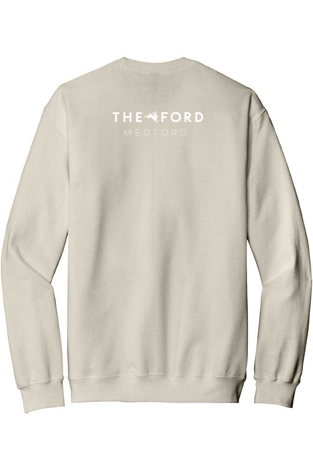 Beige crewneck sweatshirt featuring The Ford Medford logo in white on the back, made from soft cotton-poly blend.