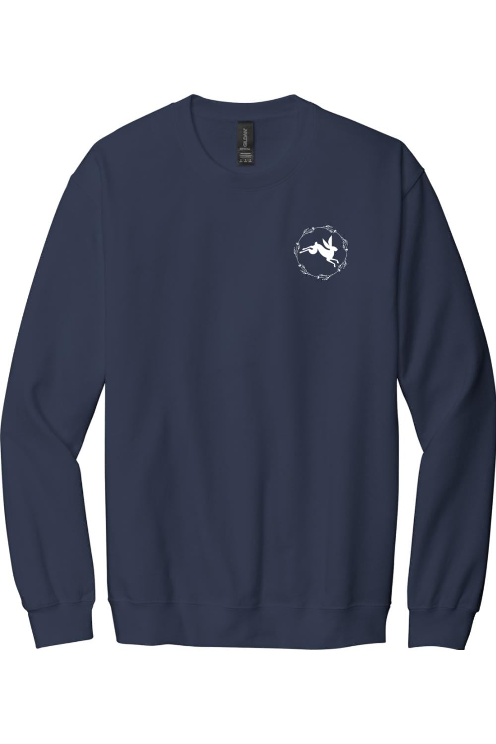 Navy blue crewneck sweatshirt featuring a small white rabbit logo inside a circular floral wreath on the chest.