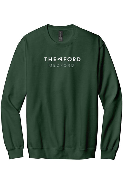 Dark green crewneck sweatshirt featuring white The Ford Medford text and a small logo graphic on the chest.