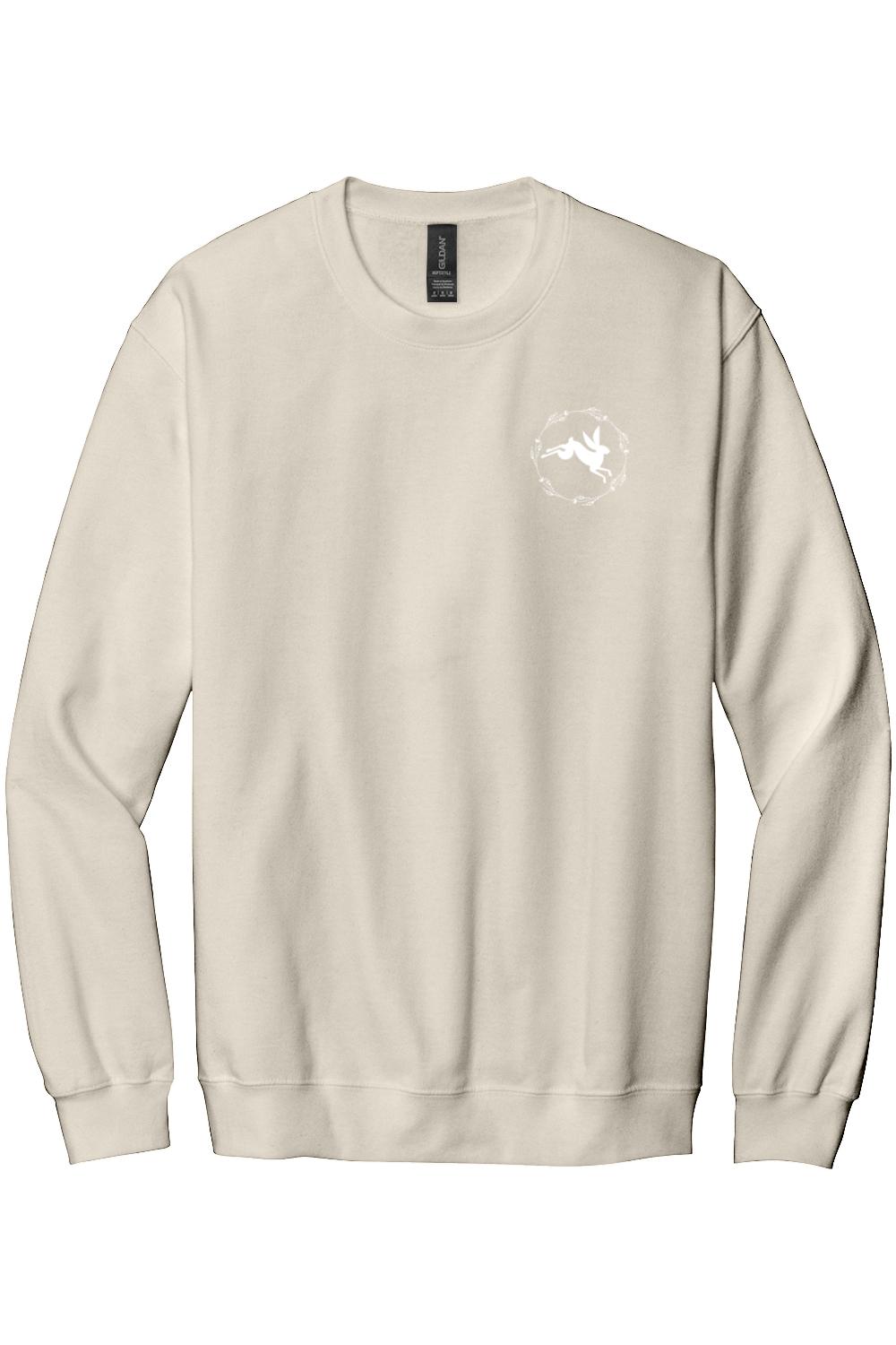 Beige crewneck sweatshirt in soft cotton-poly blend featuring a white rabbit graphic inside a floral wreath.