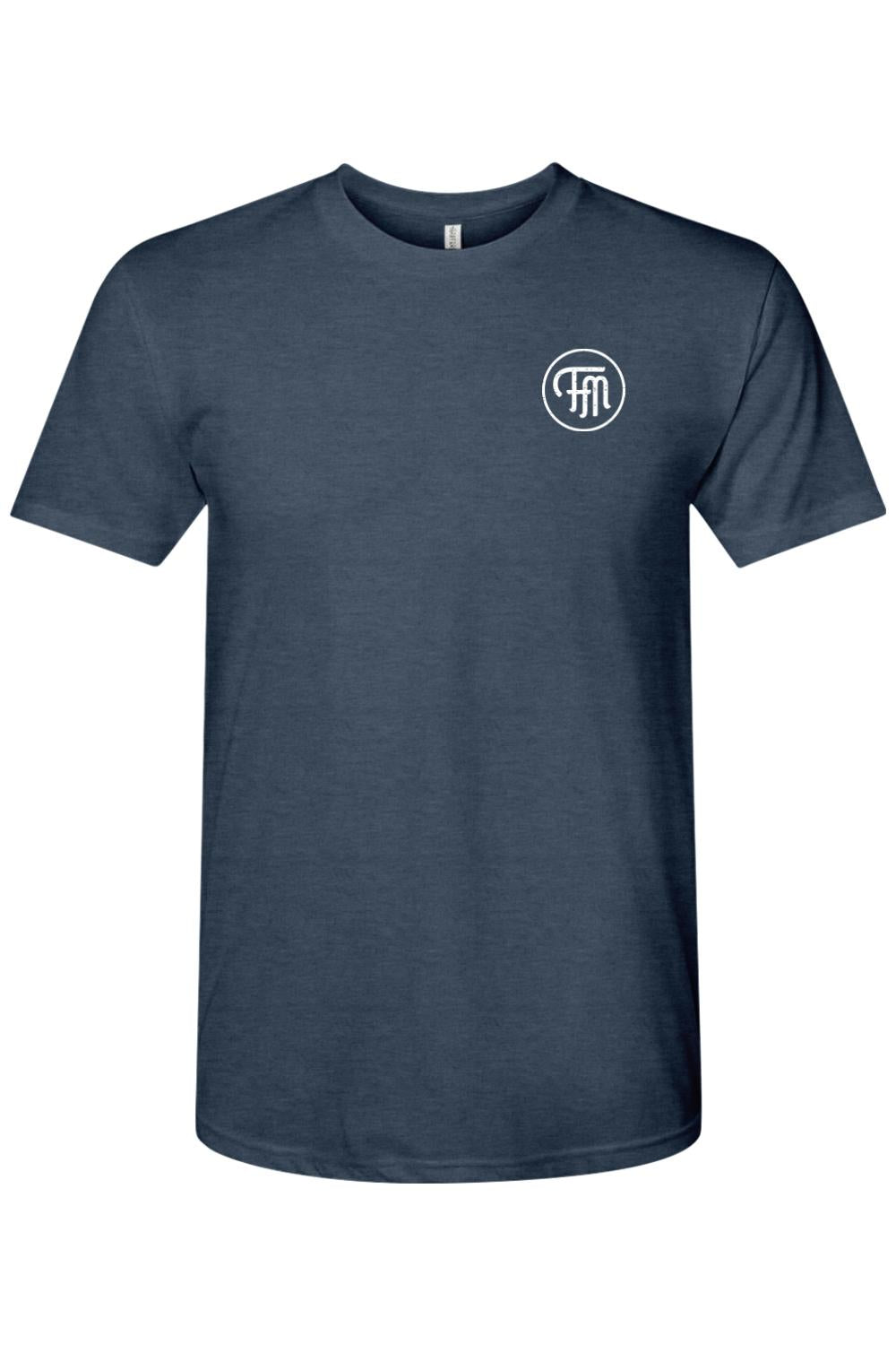 Navy blue tri-blend crew neck t-shirt featuring a white circular FM logo on the left chest.