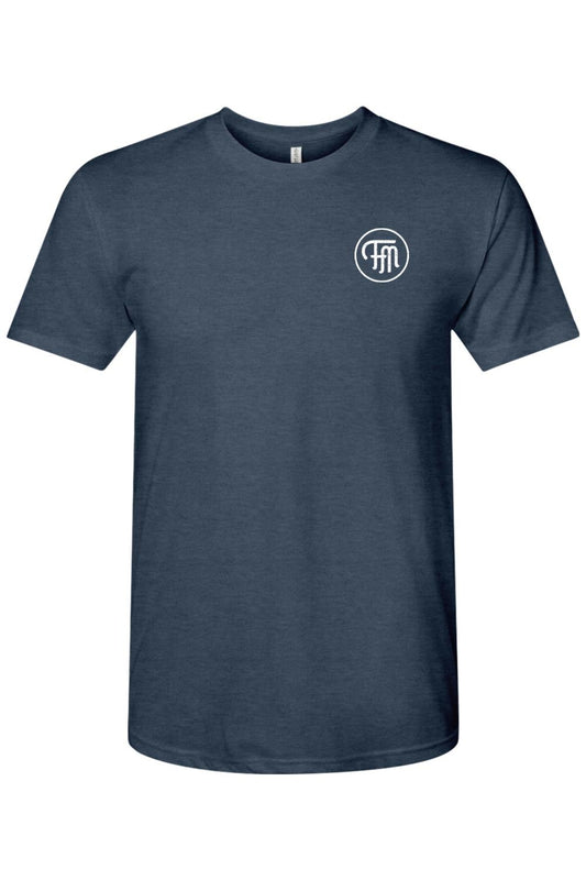 Navy blue tri-blend crew neck t-shirt featuring a white circular FM logo on the left chest.