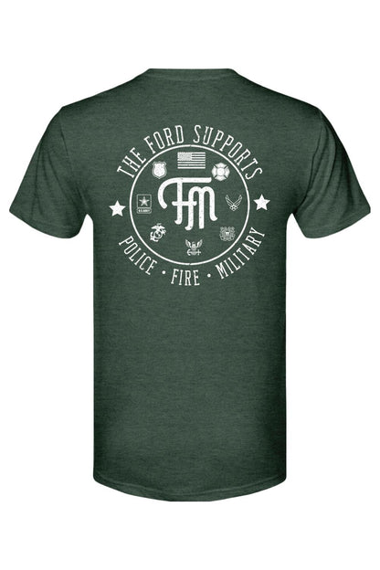 Dark green triblend t-shirt featuring a white graphic on the back honoring police, fire, and military service branches.
