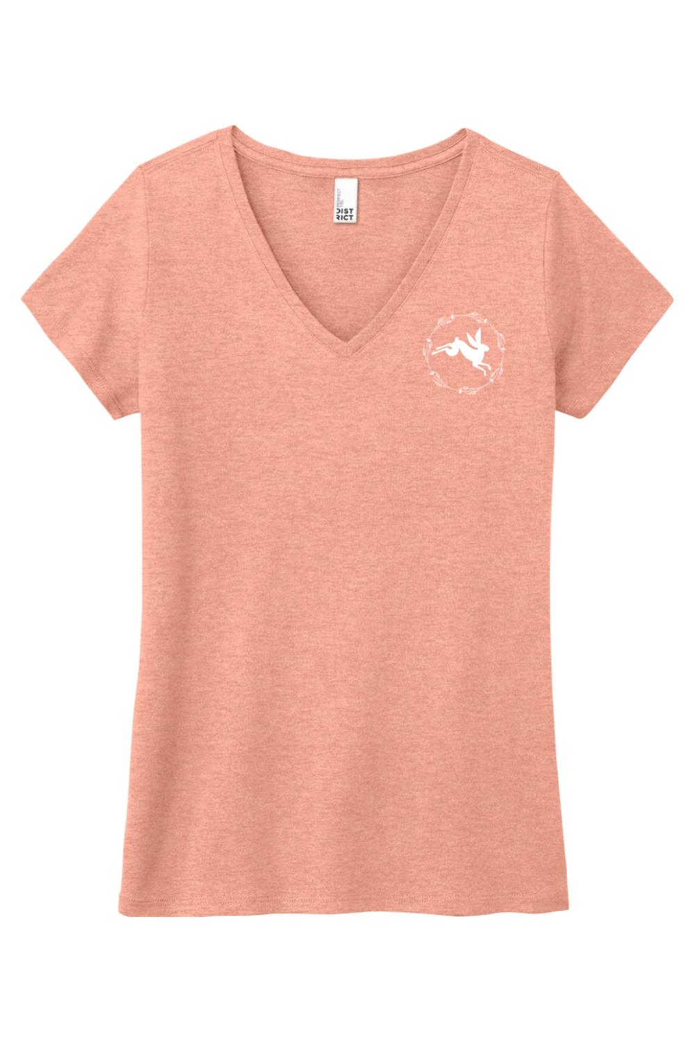Soft peach triblend women's v-neck tee featuring a white rabbit graphic inside a floral wreath on the chest.