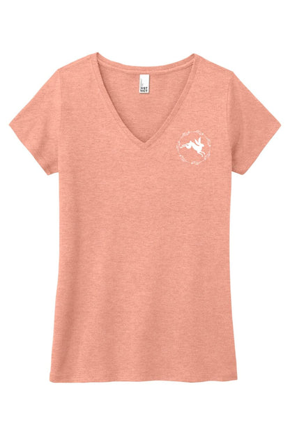 Soft peach triblend women's v-neck tee featuring a white rabbit graphic inside a floral wreath on the chest.