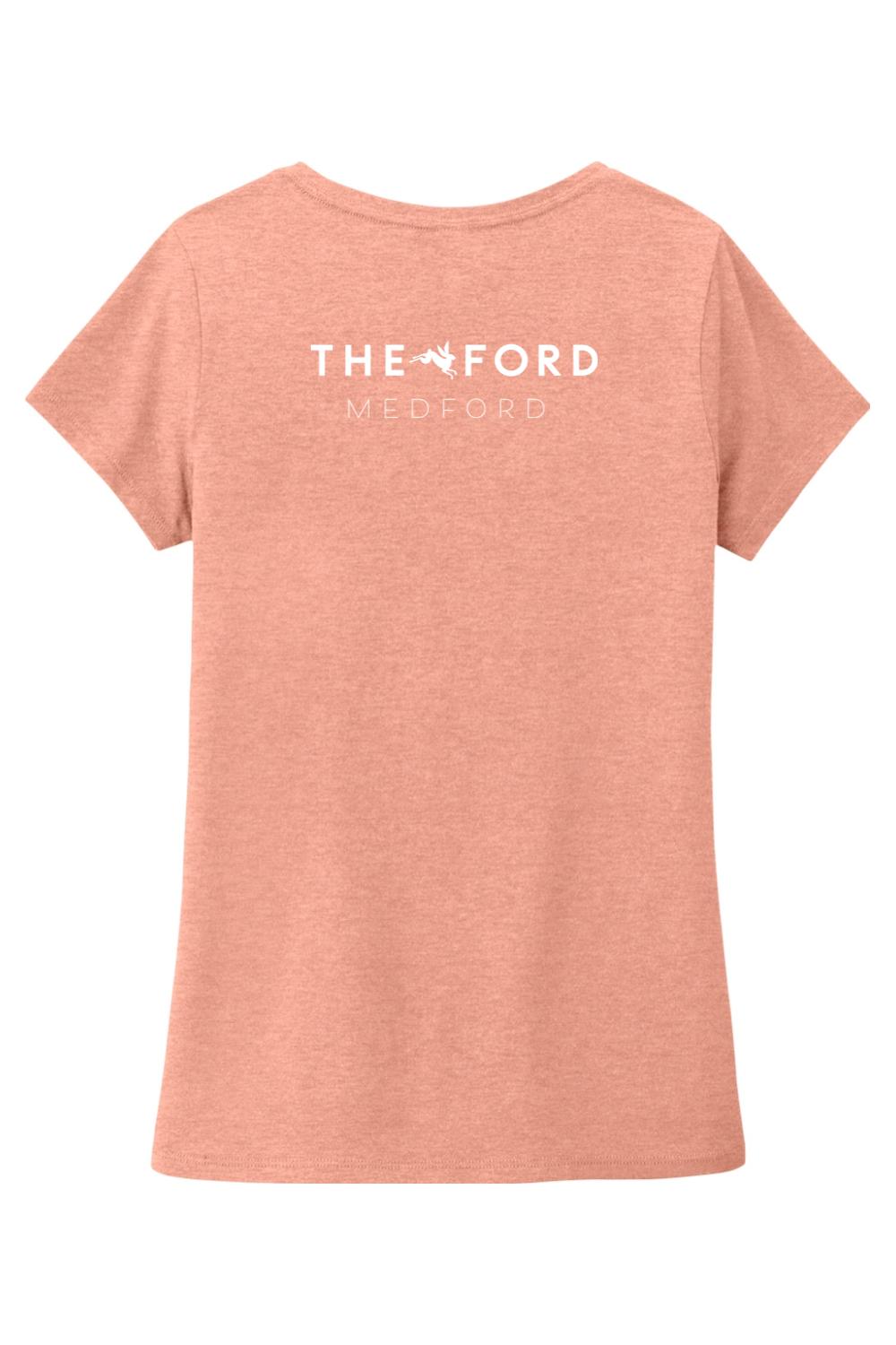 Soft peach triblend women's V-neck tee featuring The Ford Medford logo on the back.