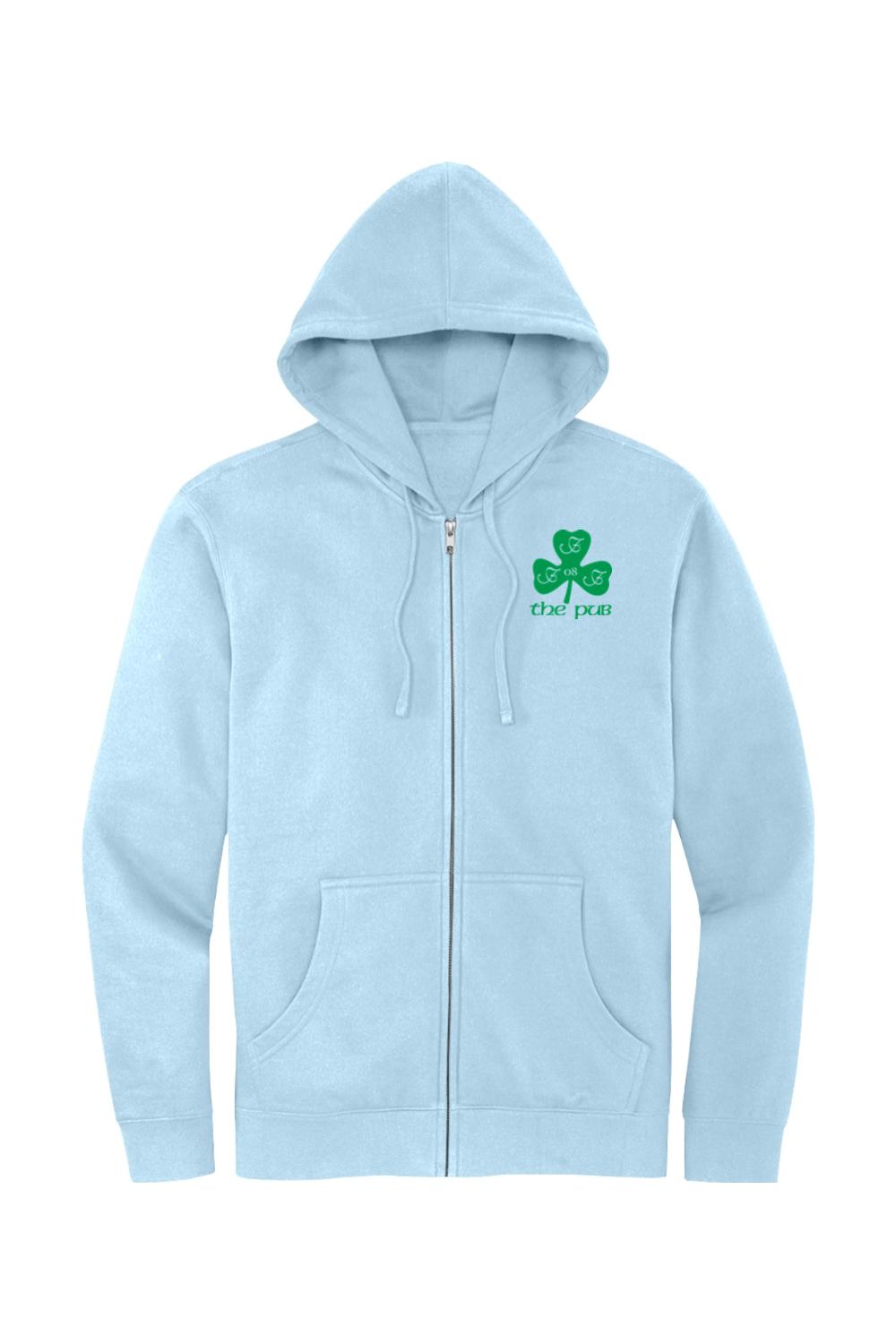 Light blue full-zip hoodie featuring a green shamrock logo with "the pub" text on the chest and a jersey-lined hood.