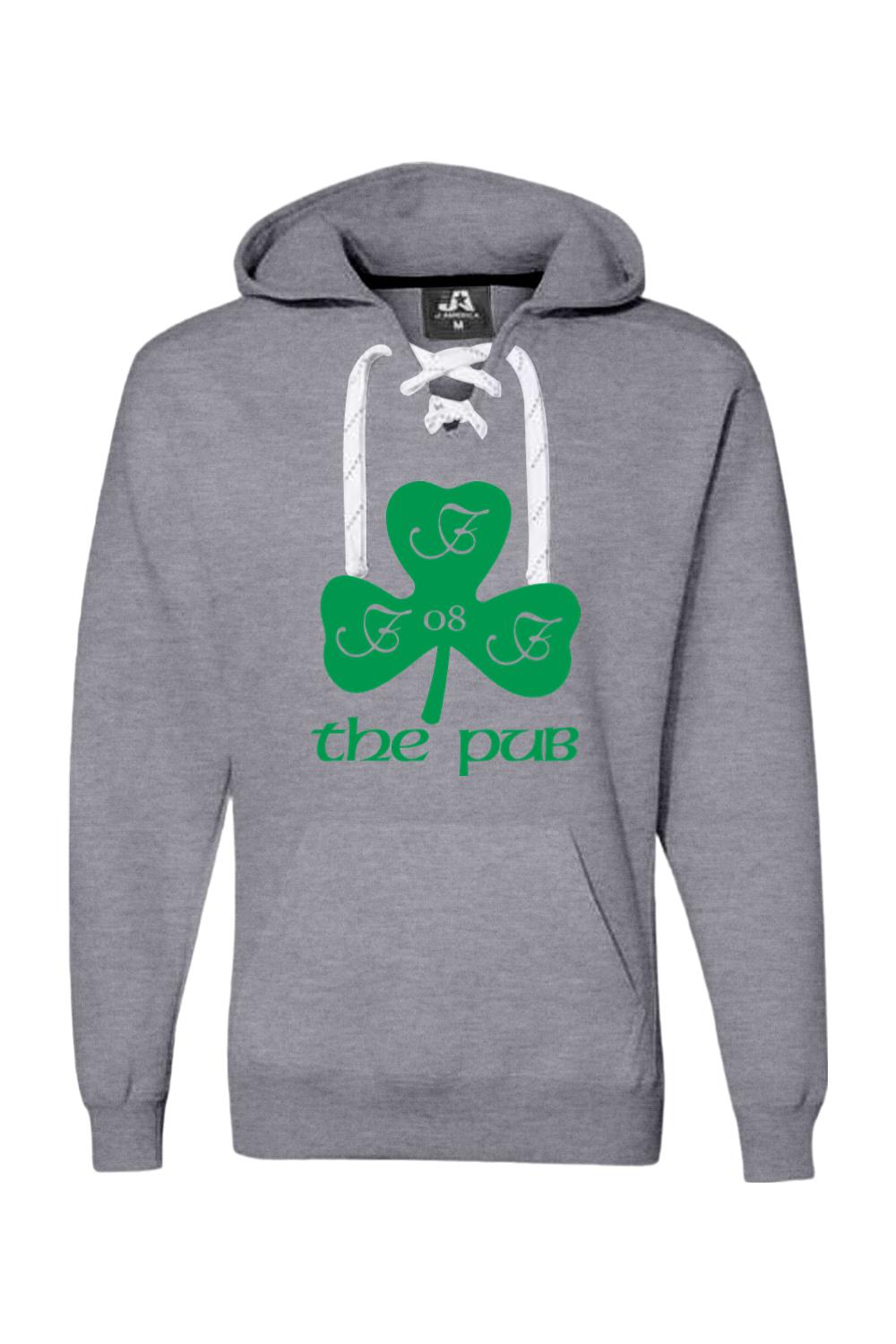 Grey hooded sweatshirt with white lace-up neckline, featuring a green shamrock graphic and The Pub text on the front.