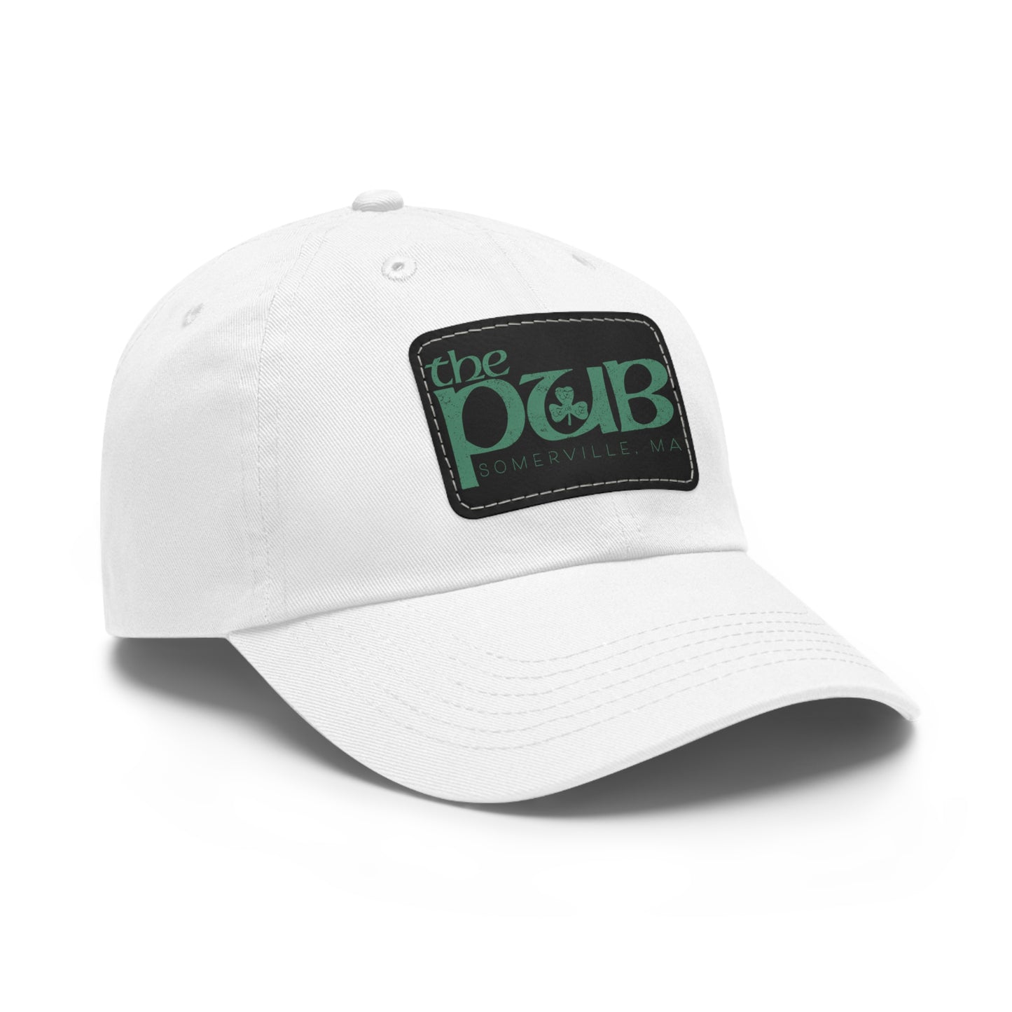 White unstructured dad hat with a black faux leather patch featuring The Pub Somerville green logo.