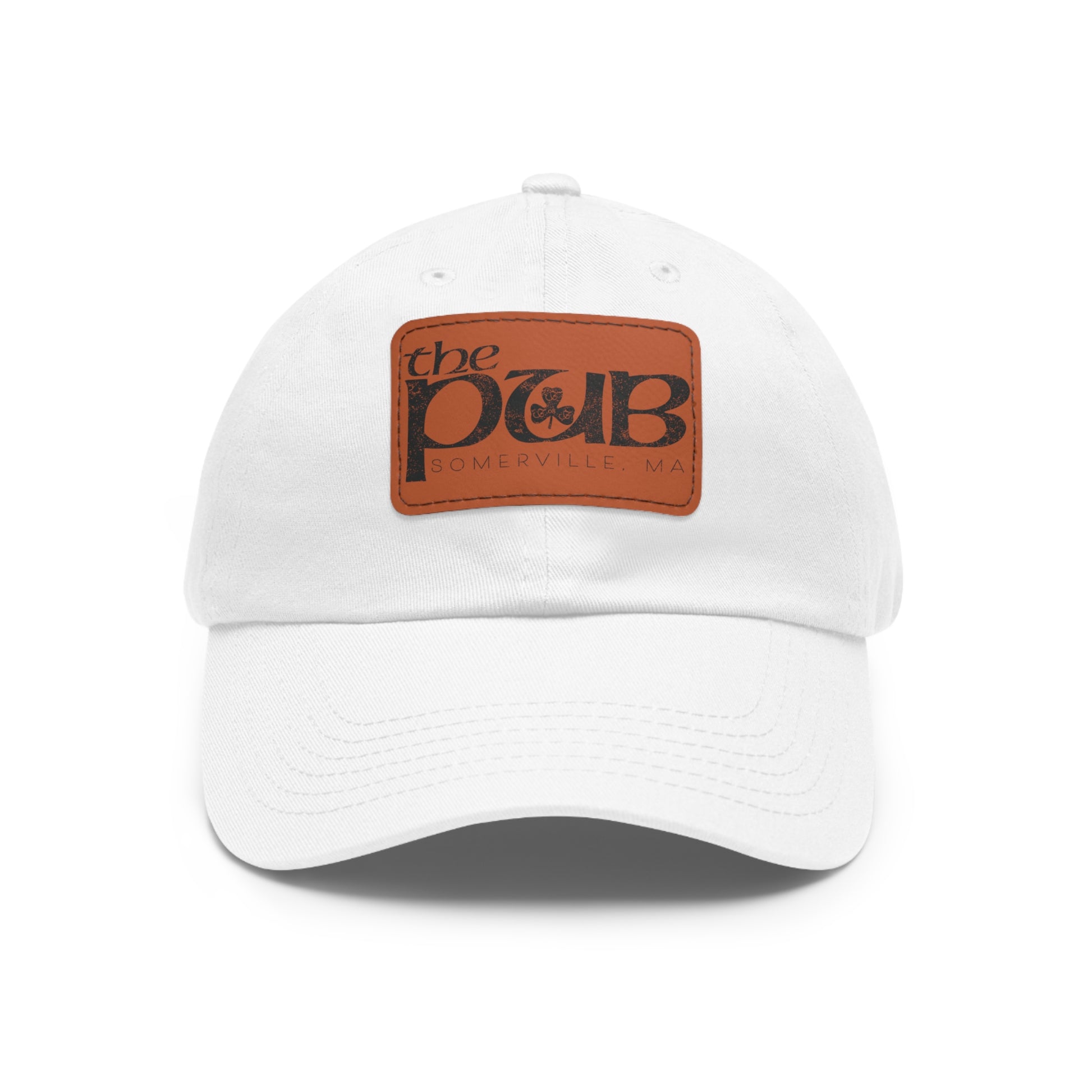 White dad hat with a brown faux leather patch featuring The Pub Somerville logo and a pre-curved bill.