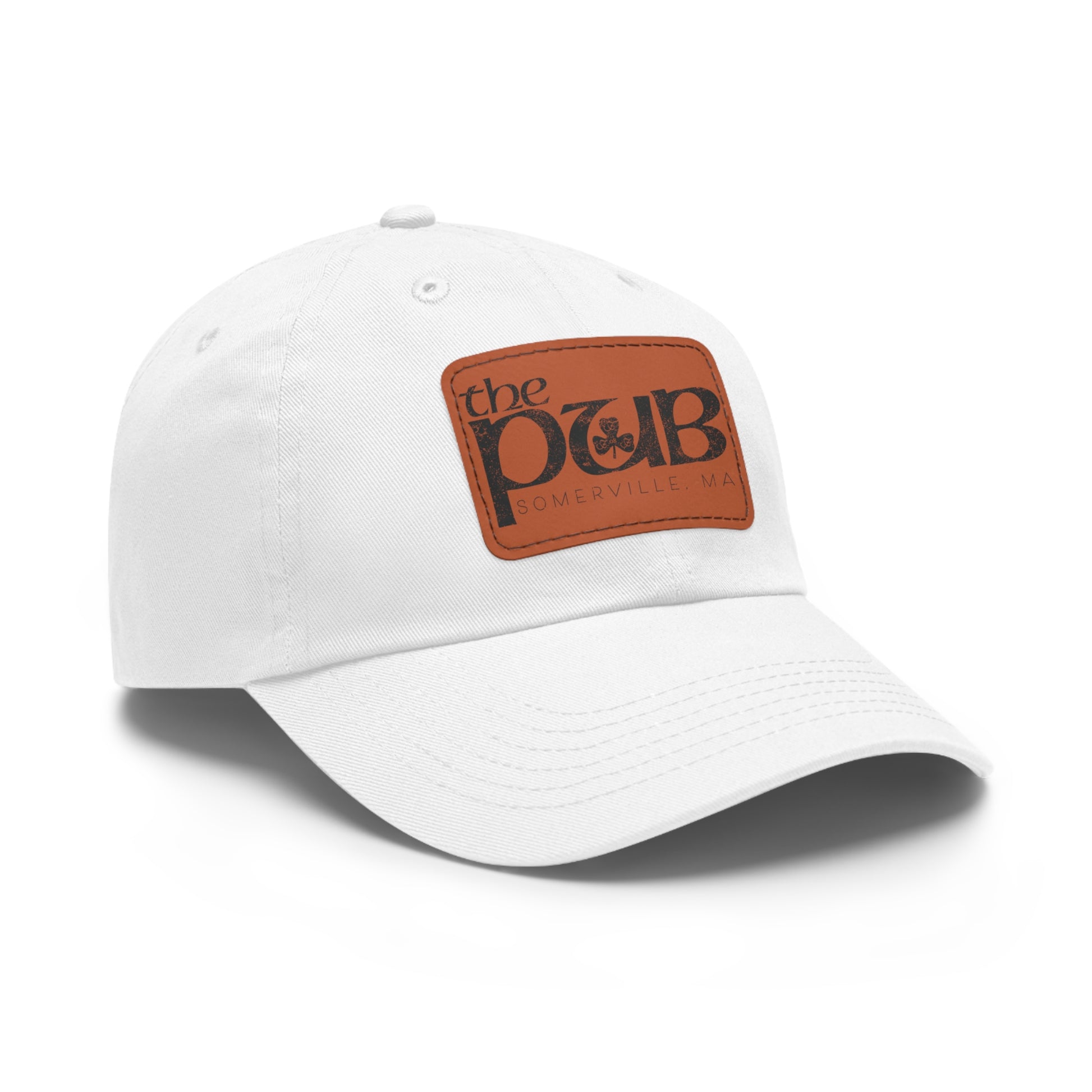 White bio-washed chino twill dad hat featuring a brown faux leather patch with The Pub Somerville logo.
