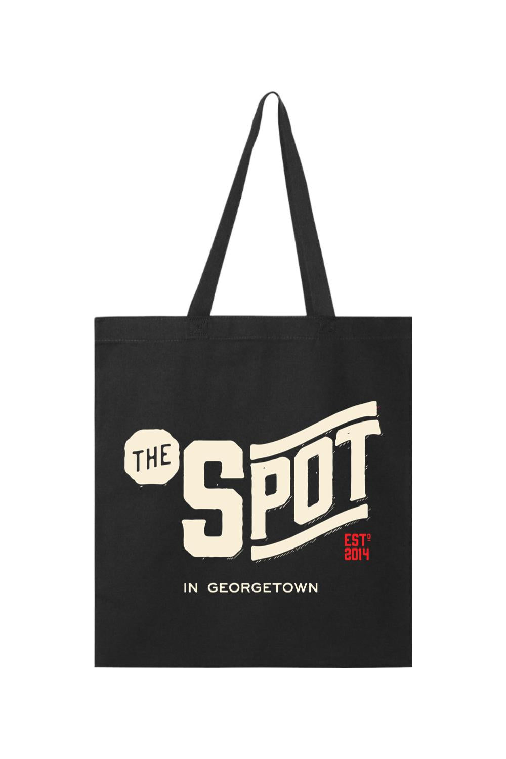 Black canvas tote bag featuring The Spot Georgetown logo in cream and red text on a white background.