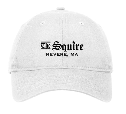 White unstructured cotton cap featuring The Squire Revere, MA logo in black embroidery with an adjustable D-clip strap.
