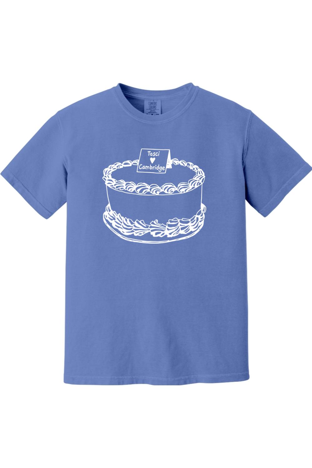 Blue Comfort Colors short sleeve t-shirt featuring a white line-art graphic of a cake labeled Tosci Cambridge.