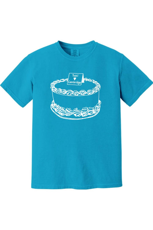 Bright blue Comfort Colors short-sleeve tee featuring a white line-art graphic of a cake labeled Tosci Loves Cambridge.