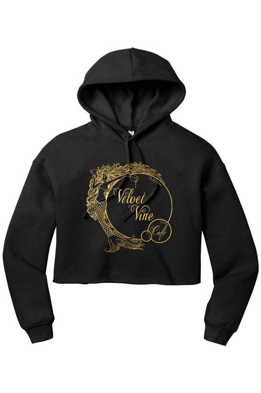 Black cropped fleece hoodie featuring a gold Velvet Vine Cafe mermaid logo graphic on the front.