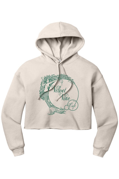 Beige cropped fleece hoodie featuring a green Velvet Vine Cafe mermaid logo graphic and drawstring hood.