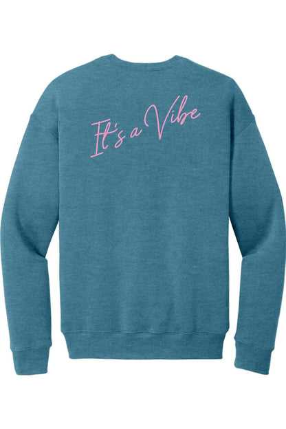 Blue sponge fleece crewneck sweatshirt featuring pink cursive text on the back that reads It's a Vibe.
