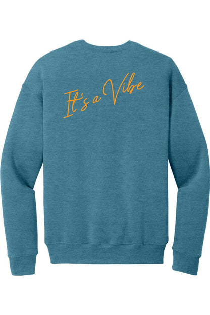 Blue sponge fleece crewneck sweatshirt featuring It's a Vibe in orange cursive script on the back.