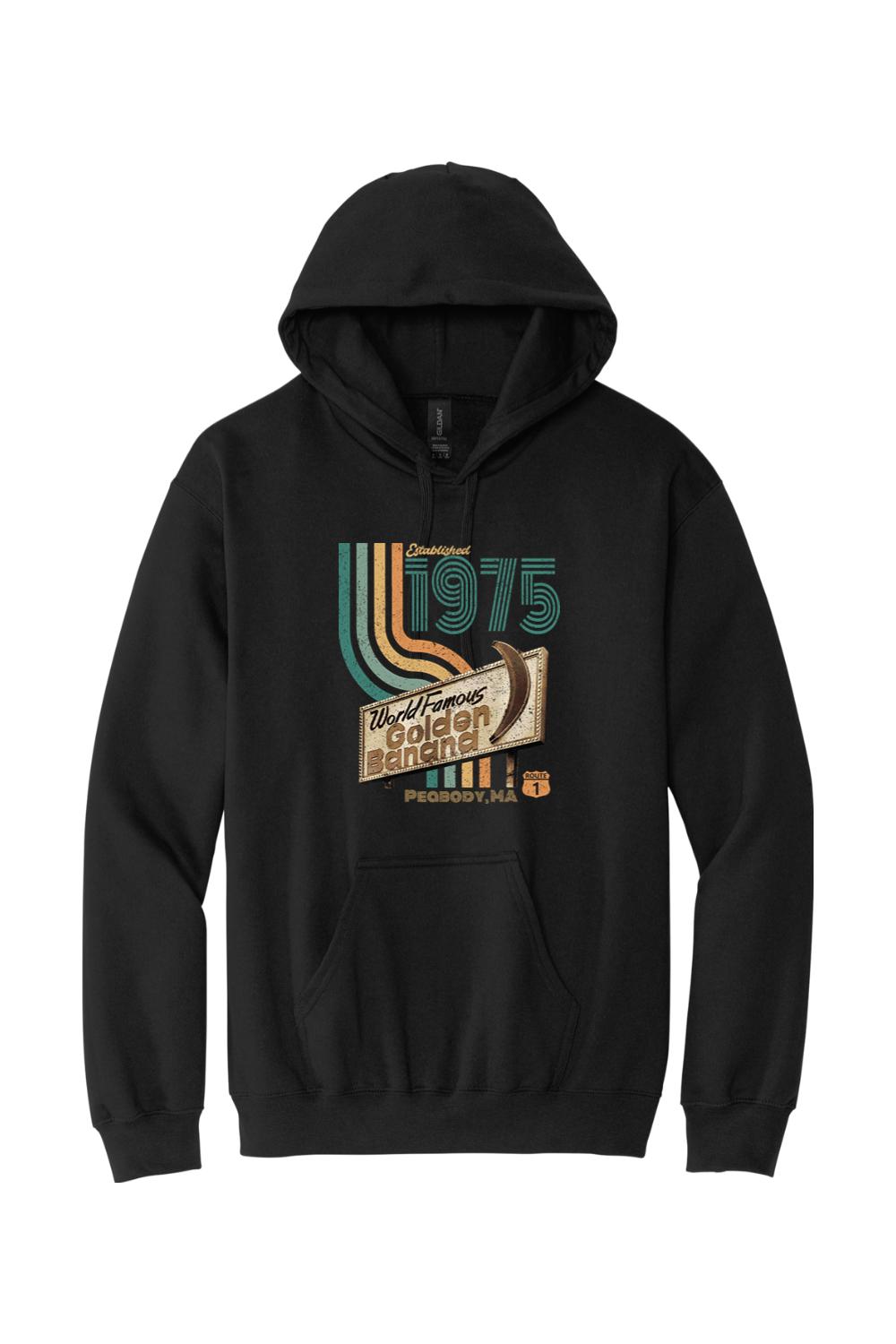 Black hooded sweatshirt featuring a vintage 1975 World Famous Golden Banana graphic print in retro colors.