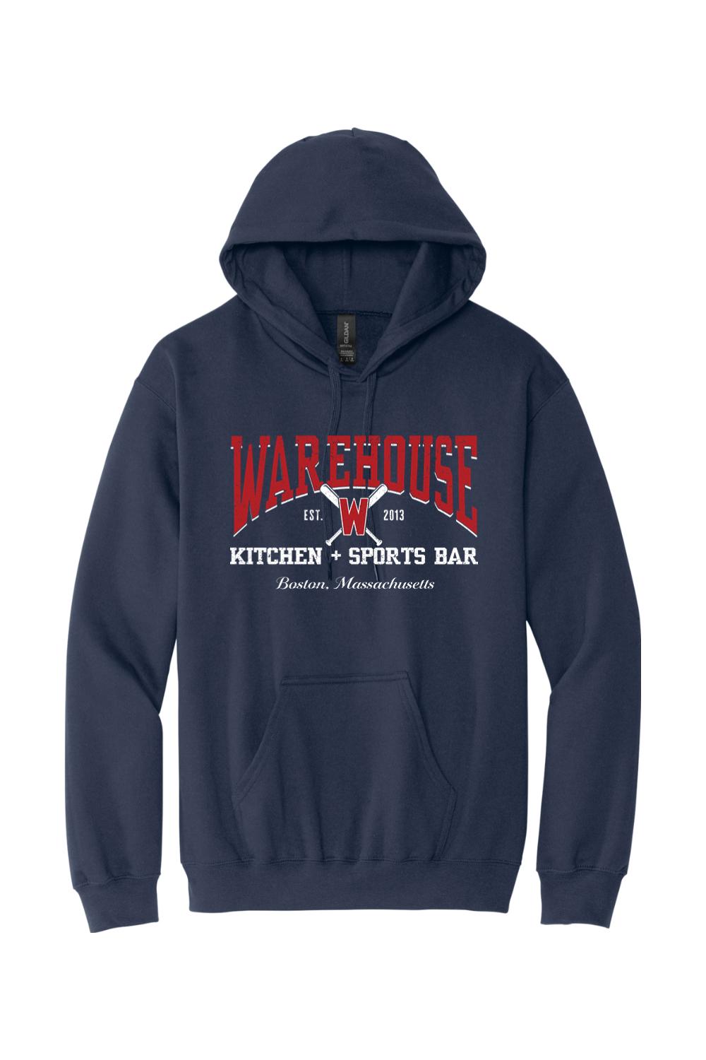 Navy blue unisex pullover hoodie with Warehouse Kitchen + Sports Bar logo and crossed baseball bats graphic.